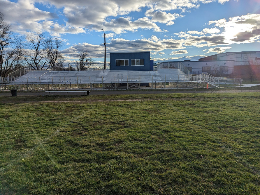 NACOM project scope includes construction of a new, 2-story 30’ x 10 CMU storage building and press box complete, metal roof panels, mechanical and electrical. All new pre-engineered bleacher system, all new concrete walkways, and grass re-establishment.